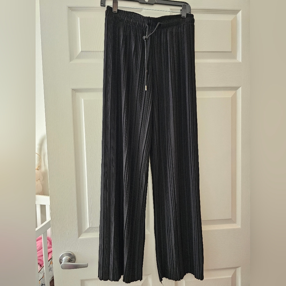Black sunset pants, no tags but never worn.